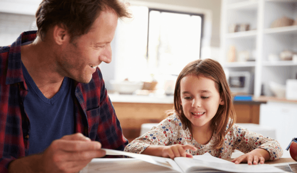 Dad homeschooling daughter